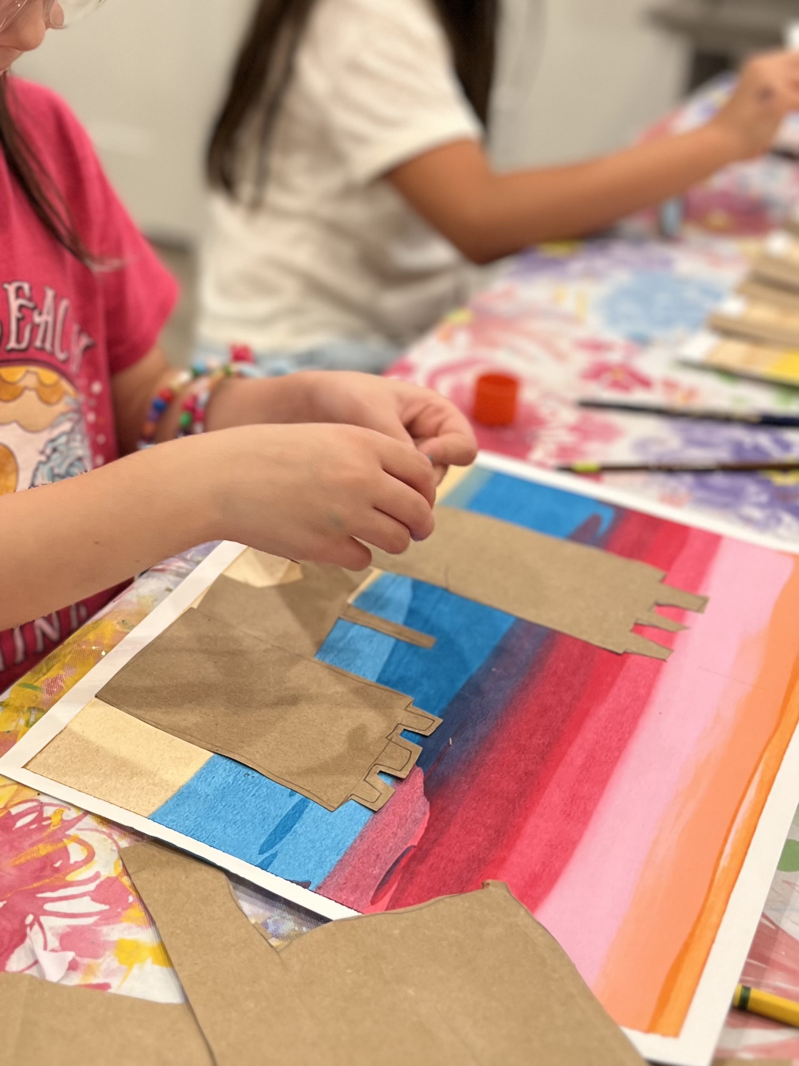 Child creating a sandcastle craft