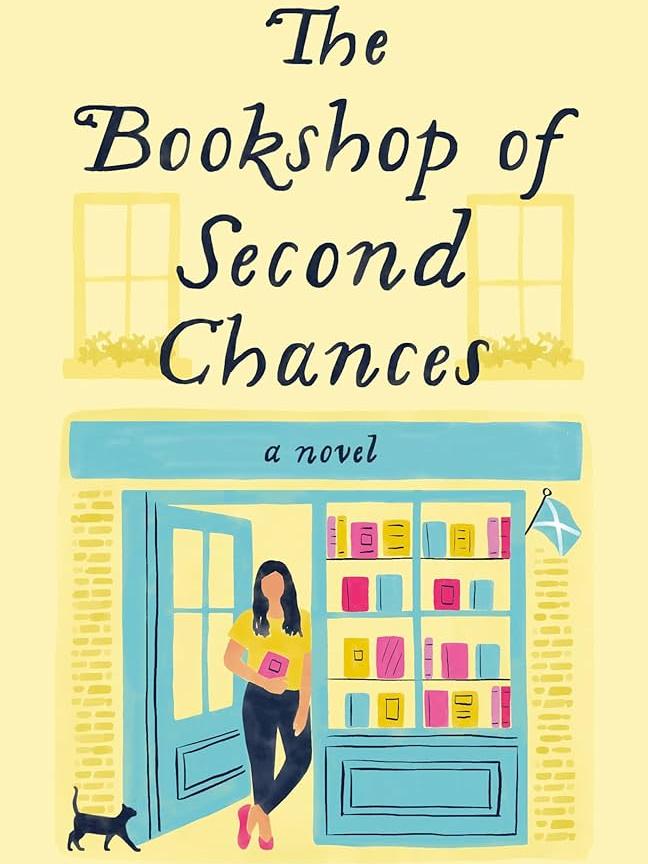 cover of "The Bookshop of Second Chances" by Jackie Frasher. The cover is mostly yellow with a blue bookshop storefront featuring multicolored books in the window and a woman and cat standing outside of it.